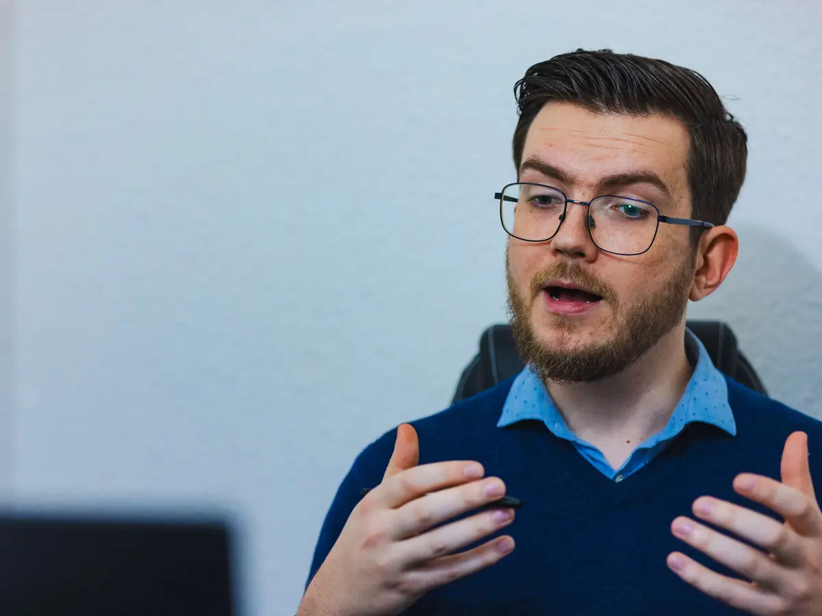 Johnny teaching a student at a whiteboard